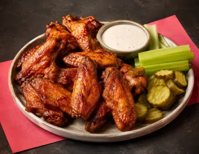 Crispy glazed chicken served with pickles and dip